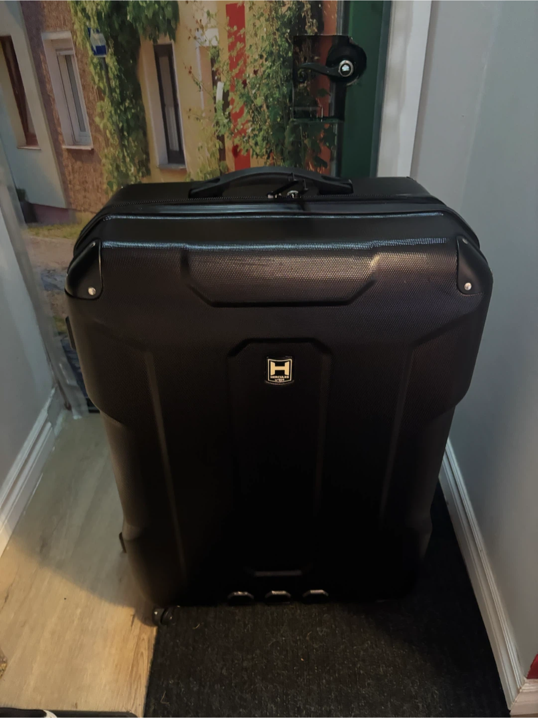 Heys Black H-Shield Hard-Shell Spinner Luggage