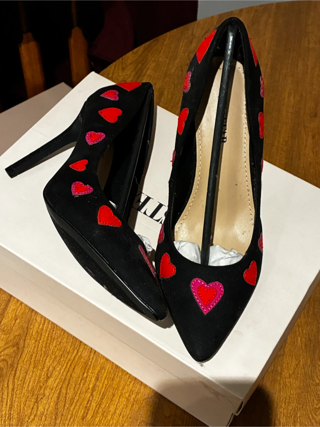 Black heels with red hearts