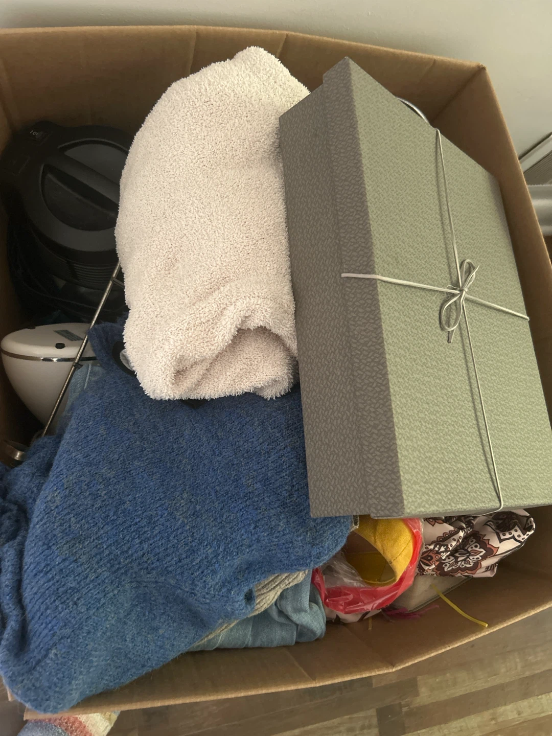 Box of assorted clothing and items