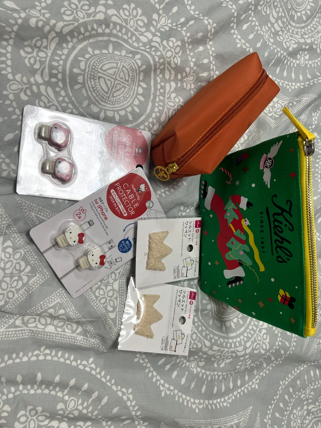 Pouch, cable protector and sticker