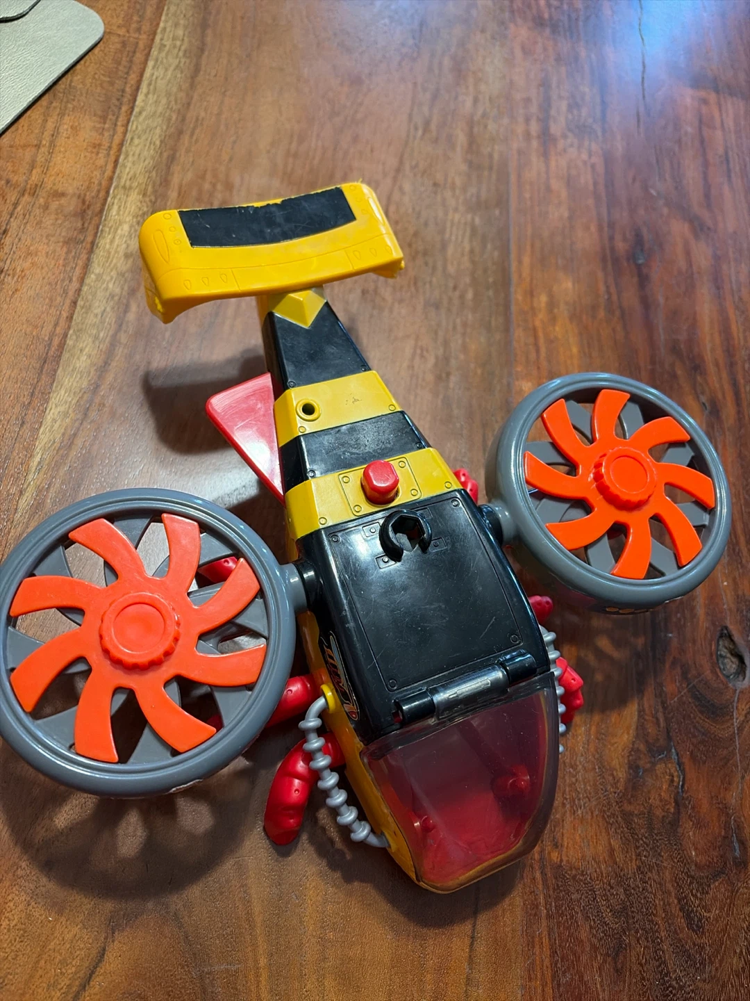 Yellow and Black Toy Helicopter with Red Accents