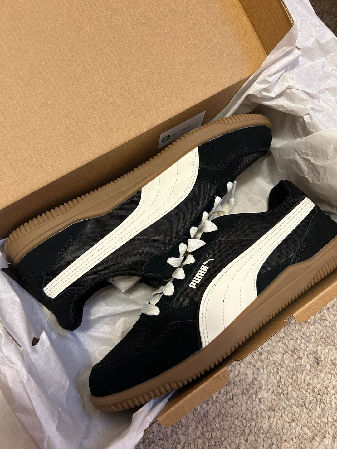 Puma black and white sneakers