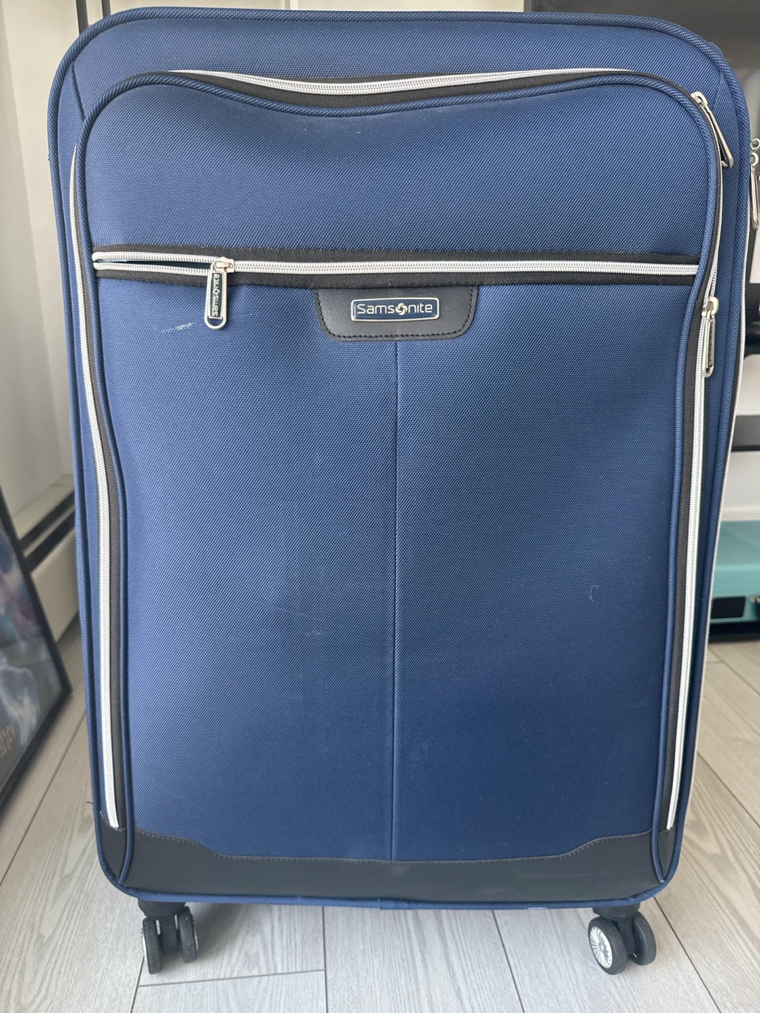 Samsonite Blue Rolling Suitcase