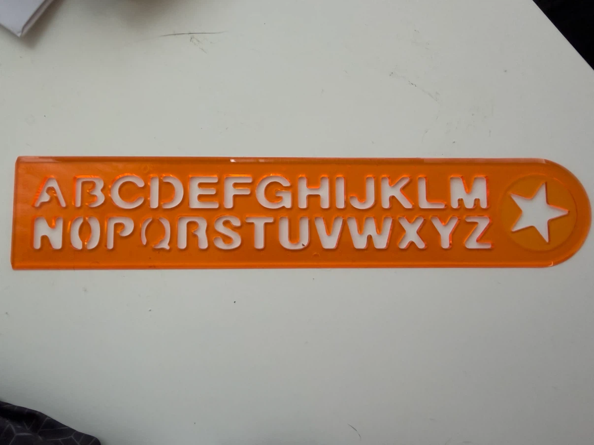 Orange ruler with alphabet