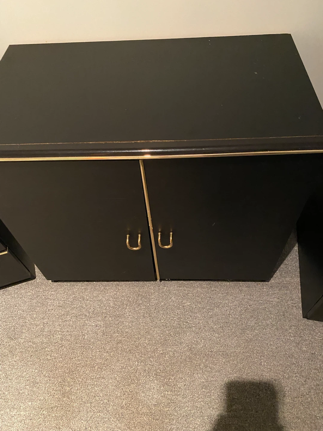 Black dresser with gold trim