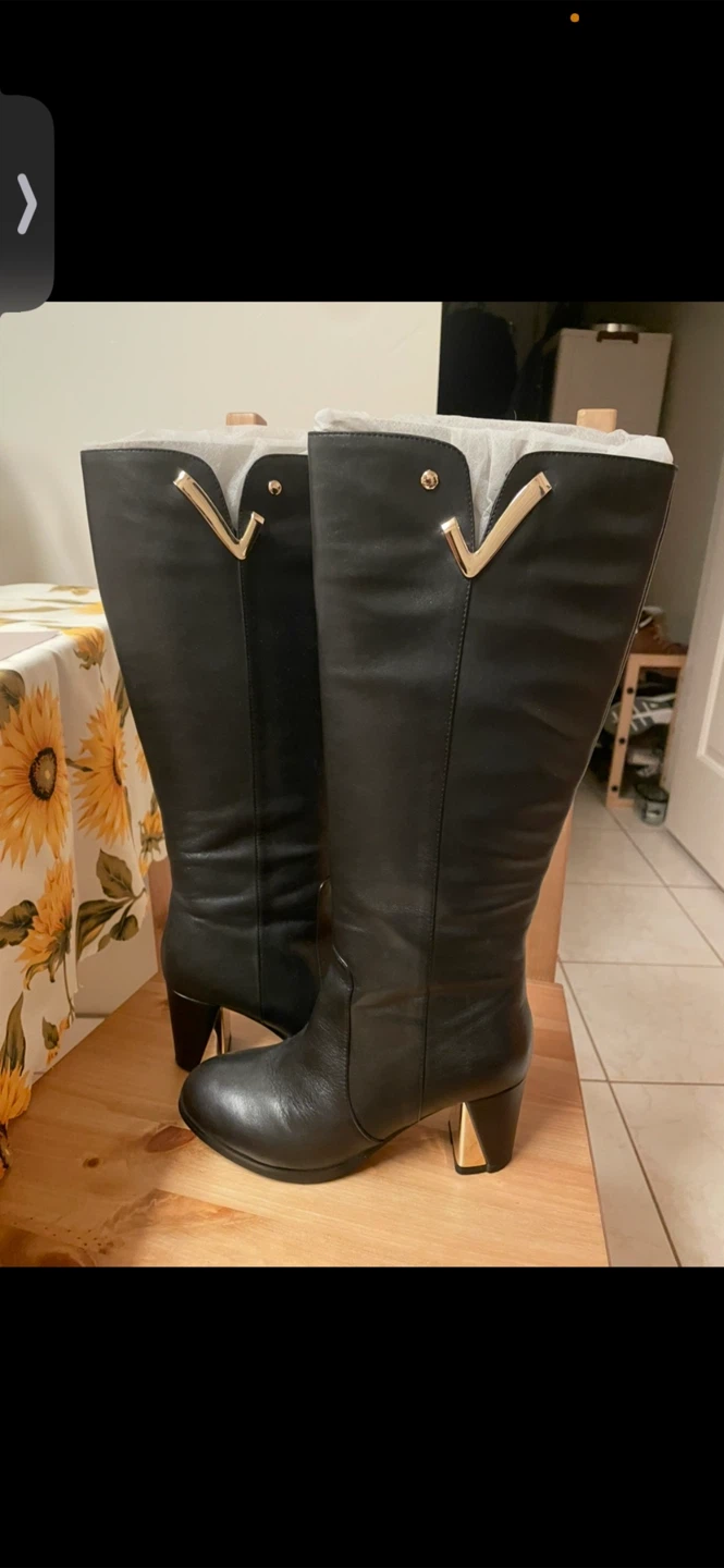Black Leather Knee-High Boots with Gold Accent