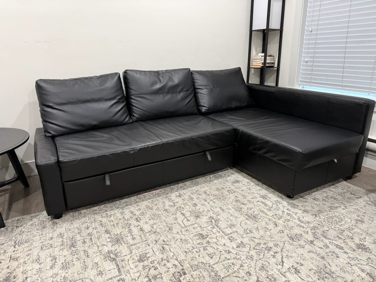 Black Faux Leather Sectional Sofa with Pull-Out Bed