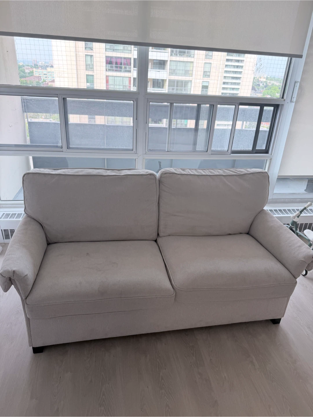 Cream coloured 2-seater sofa