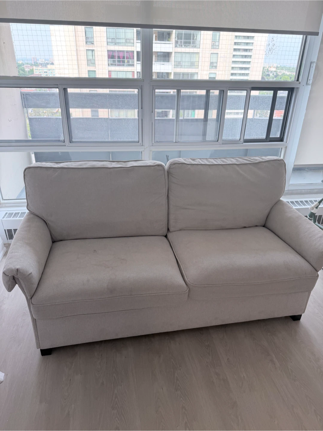 Cream coloured 2-seater sofa - photo 2