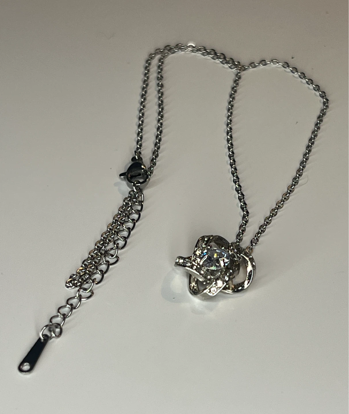 Silver tone pendant necklace with cubic zirconia