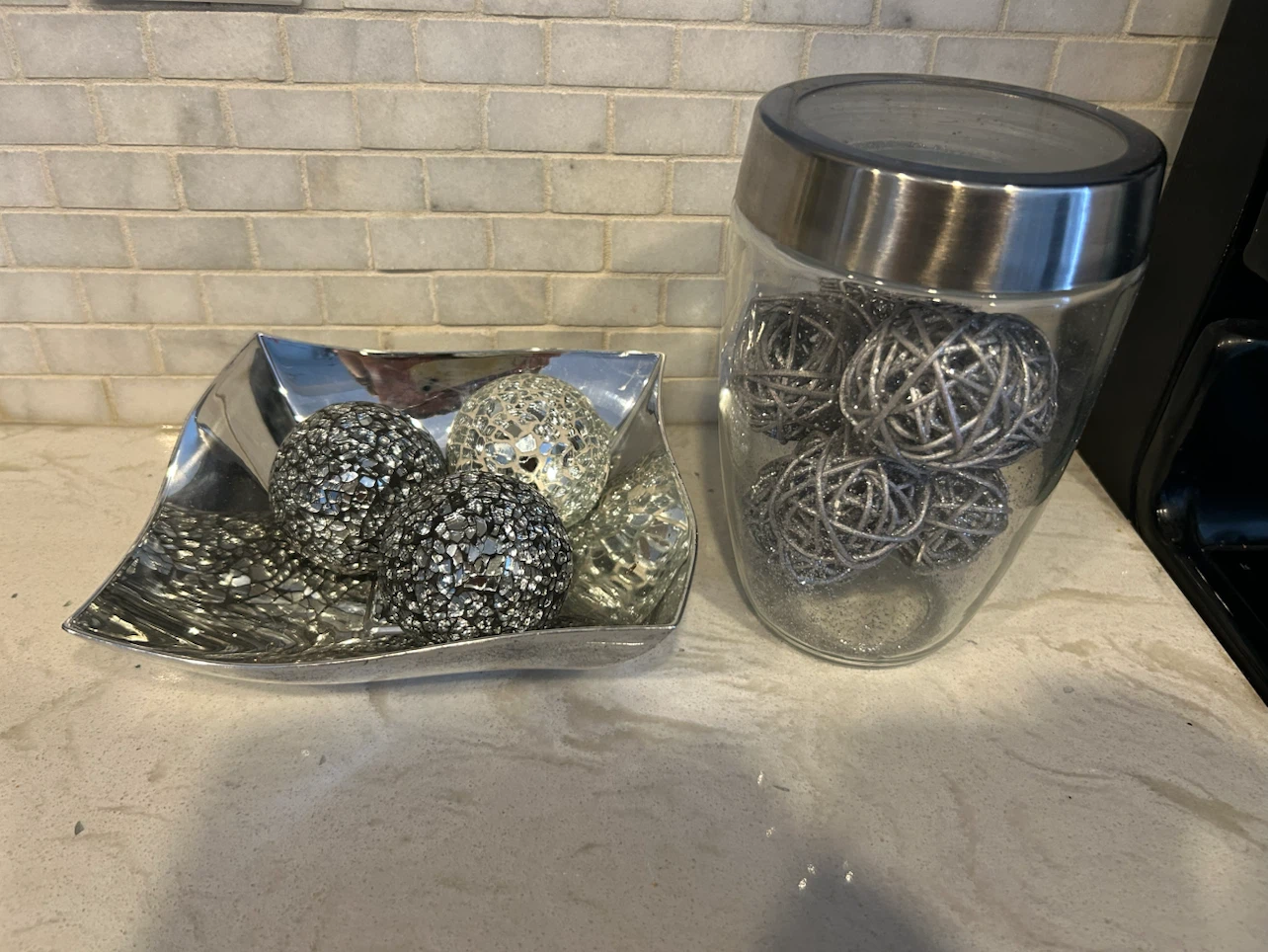Decorative sparkly orbs in bowl and glass jar