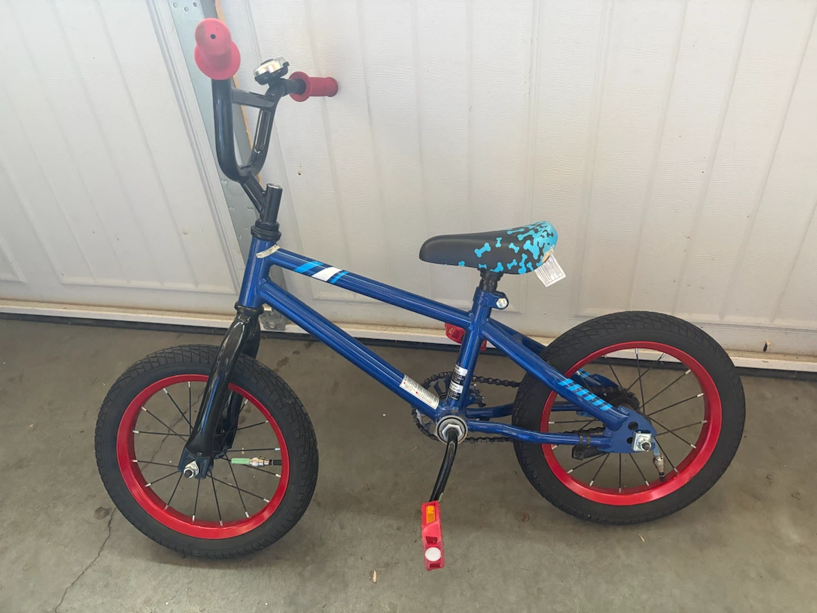 Blue Kids BMX Bike with Red Rims