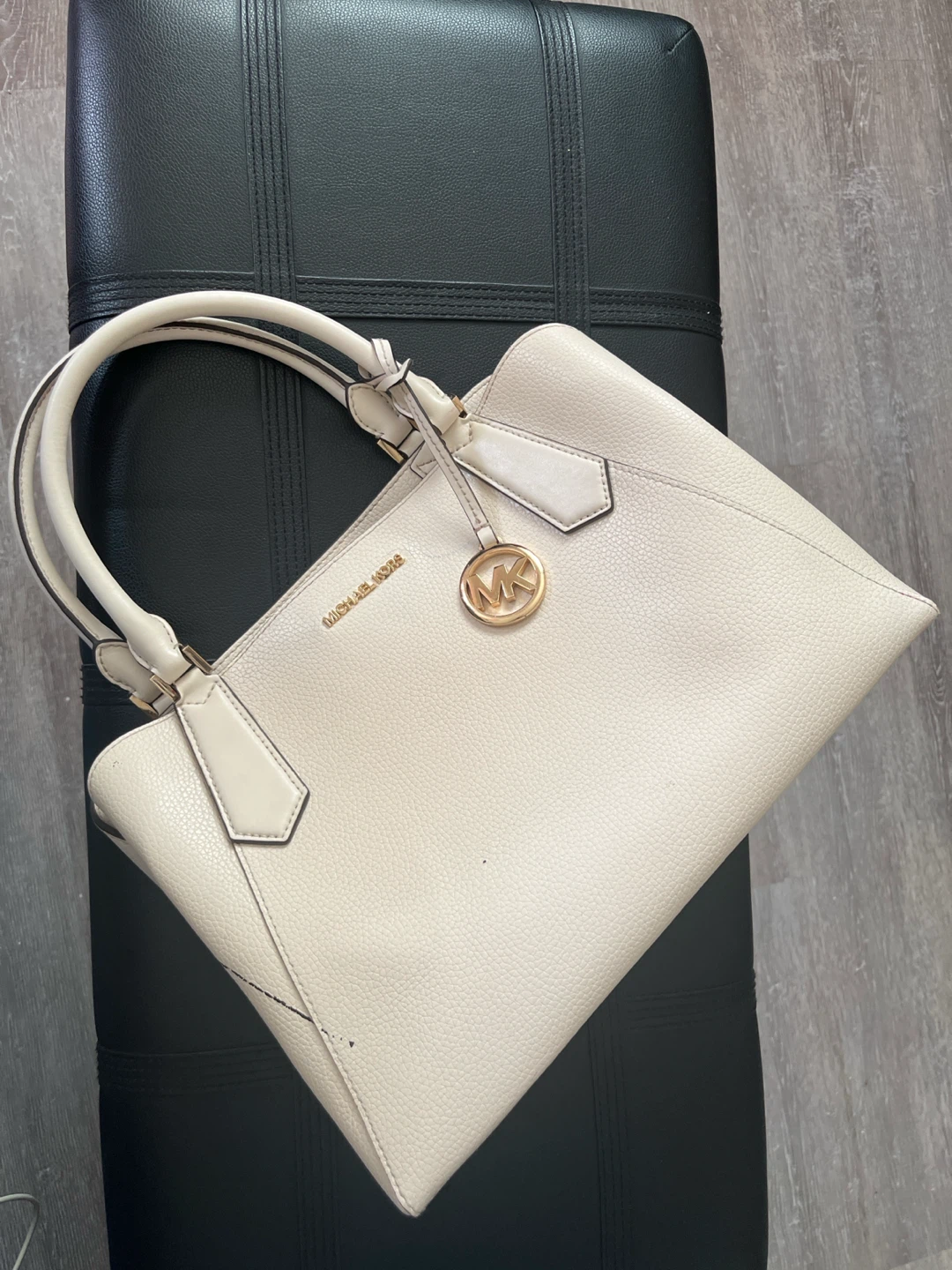 Micheal Kors cream coloured purse with paint