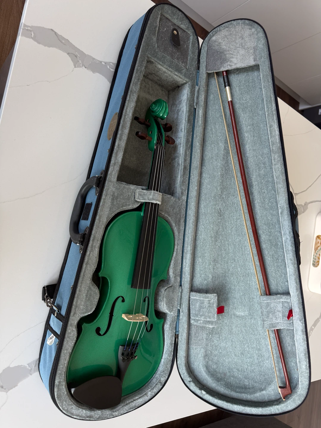 green violin with case and bow