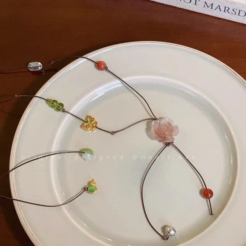Beaded Necklace with Rose and Butterfly Pendant