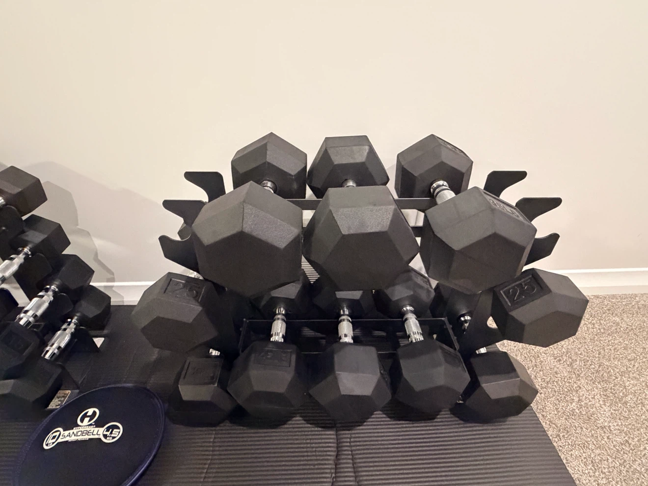 Complete Dumbbell Set with Metal Racks, Mat & Sandbag – Like New - photo 3