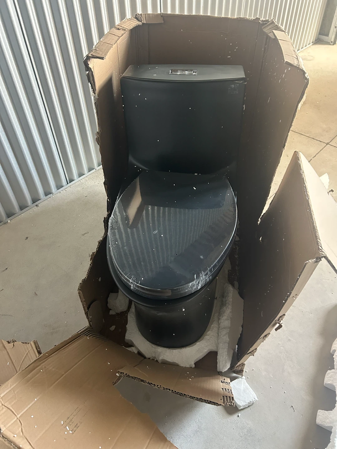 New Black one Piece Toilet It has a little chip on tank