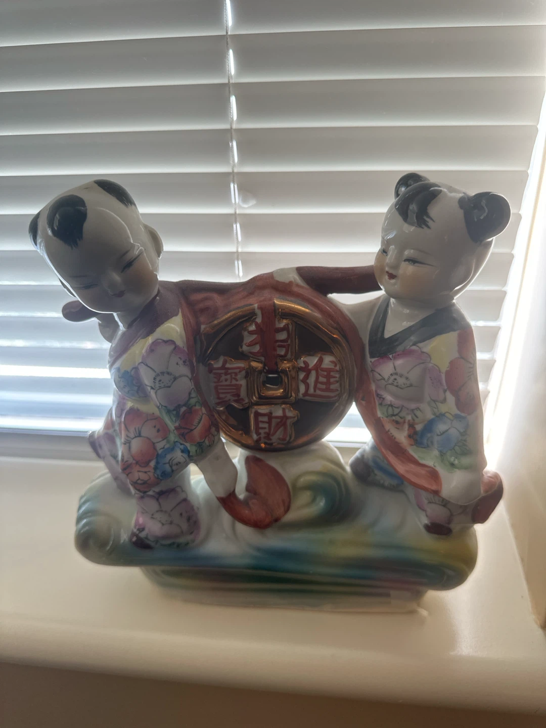Decorative Ceramic Figurine of Two Children with Coin