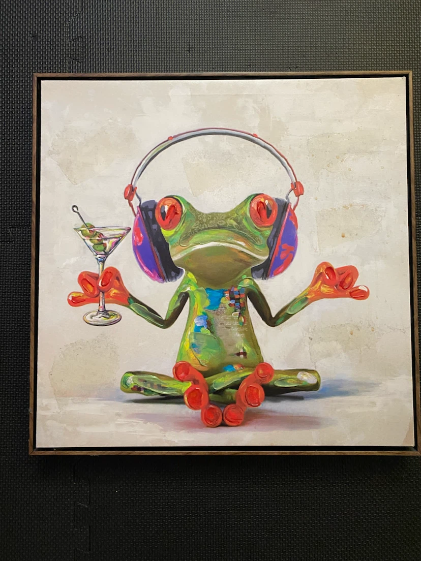 Framed canvas art of a frog with headphones and a drink