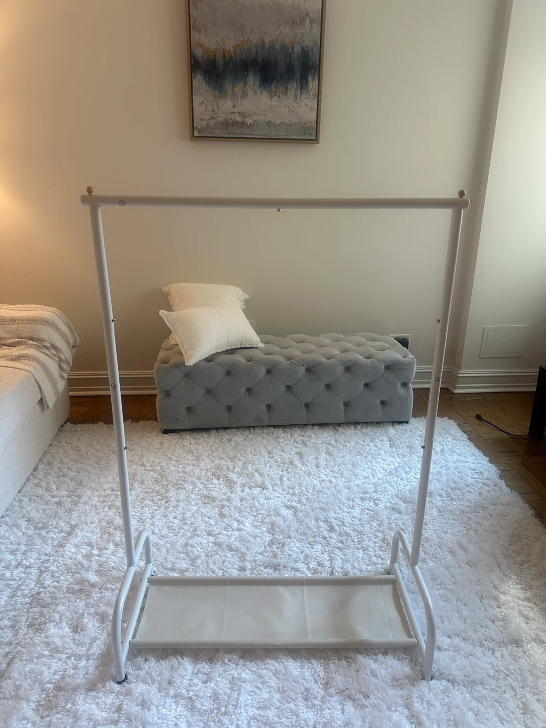 Minimalist garment rack with lower shelf