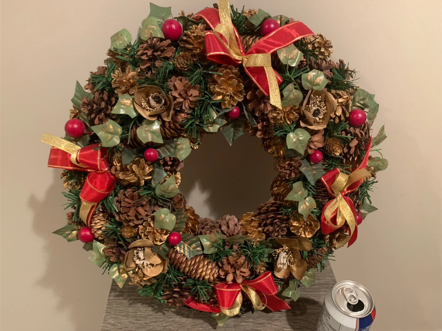 Festive Christmas Wreath with Pinecones and Red Bows