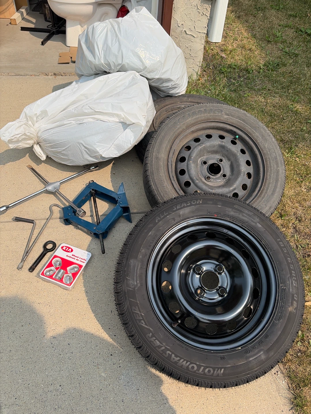 Set of 5 Tires with Jack and Wheel Locks ,    One new tire