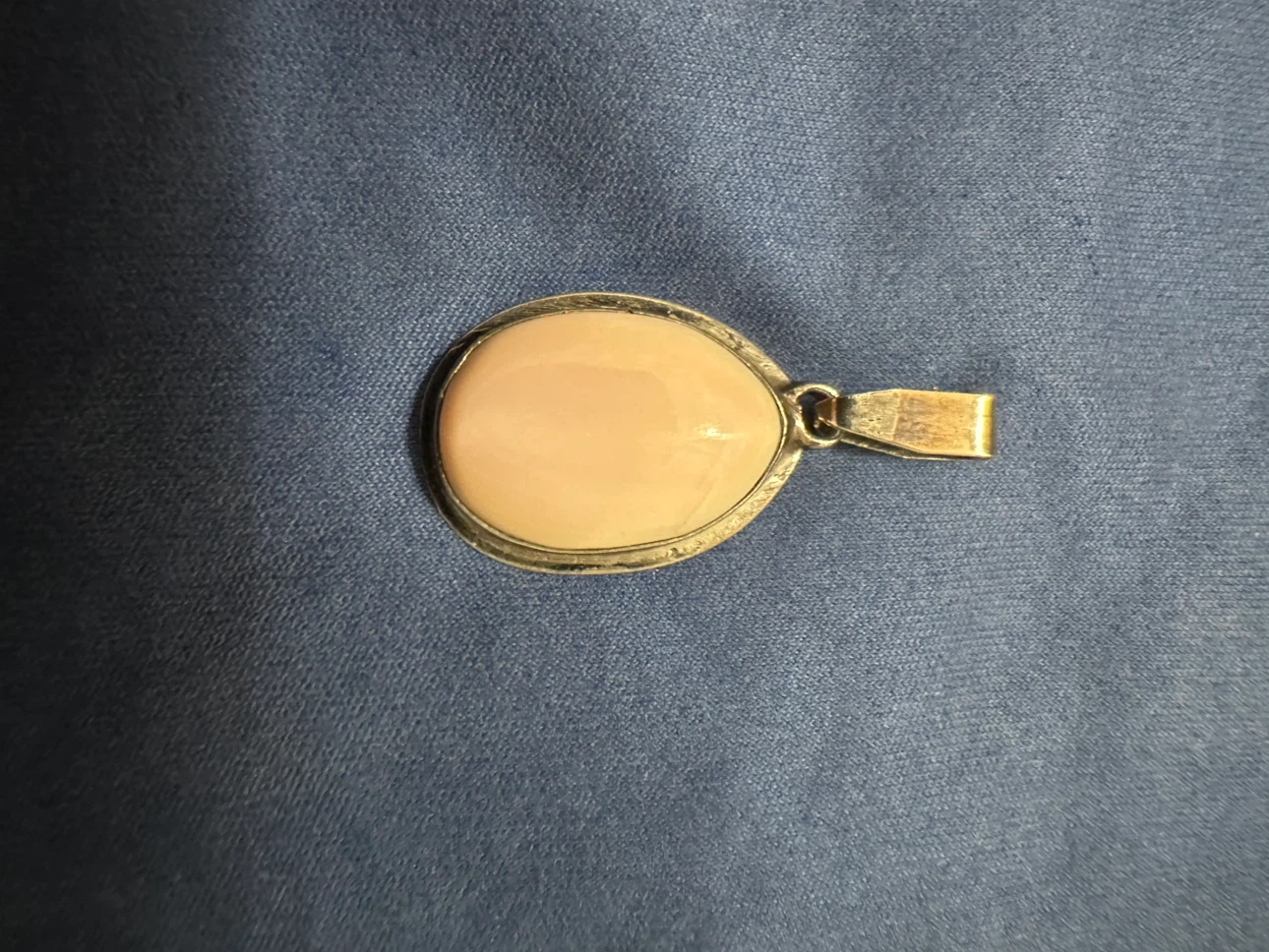 Silver Tone Oval Pendant with Pink Stone