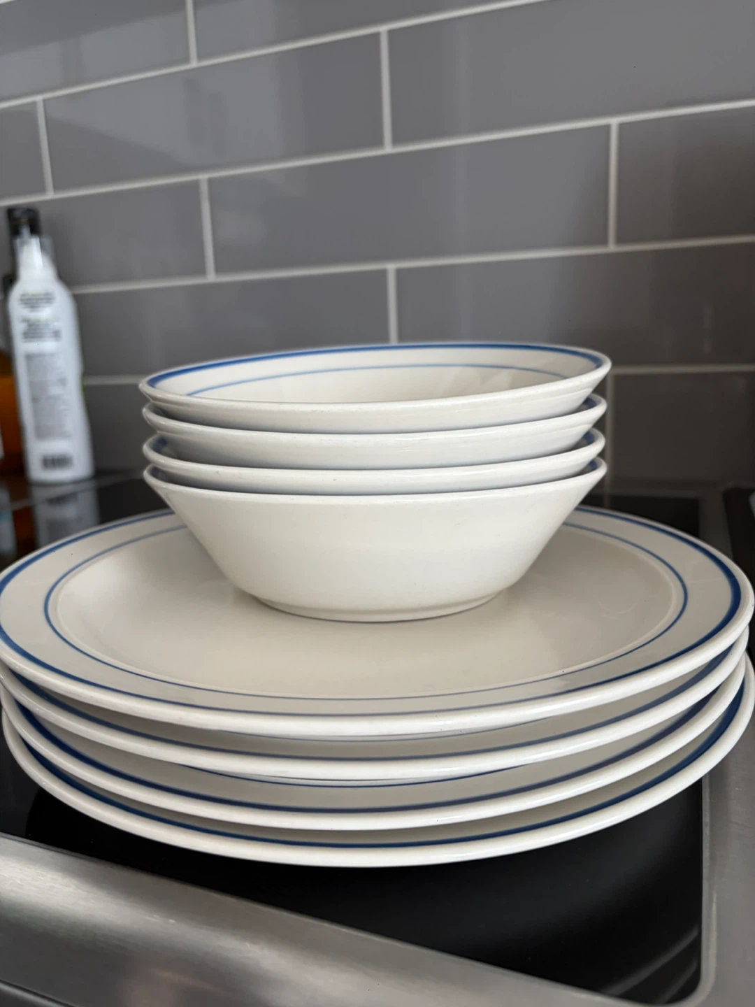 White plates and bowls with blue rim dish set
