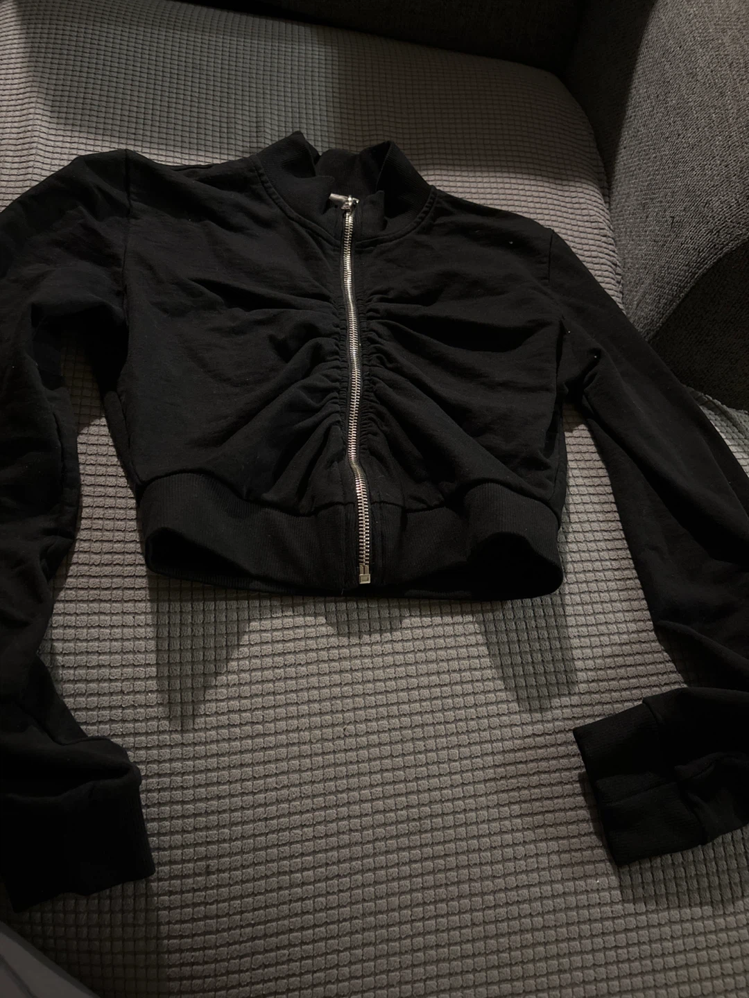 Black ruched zip-up sweater