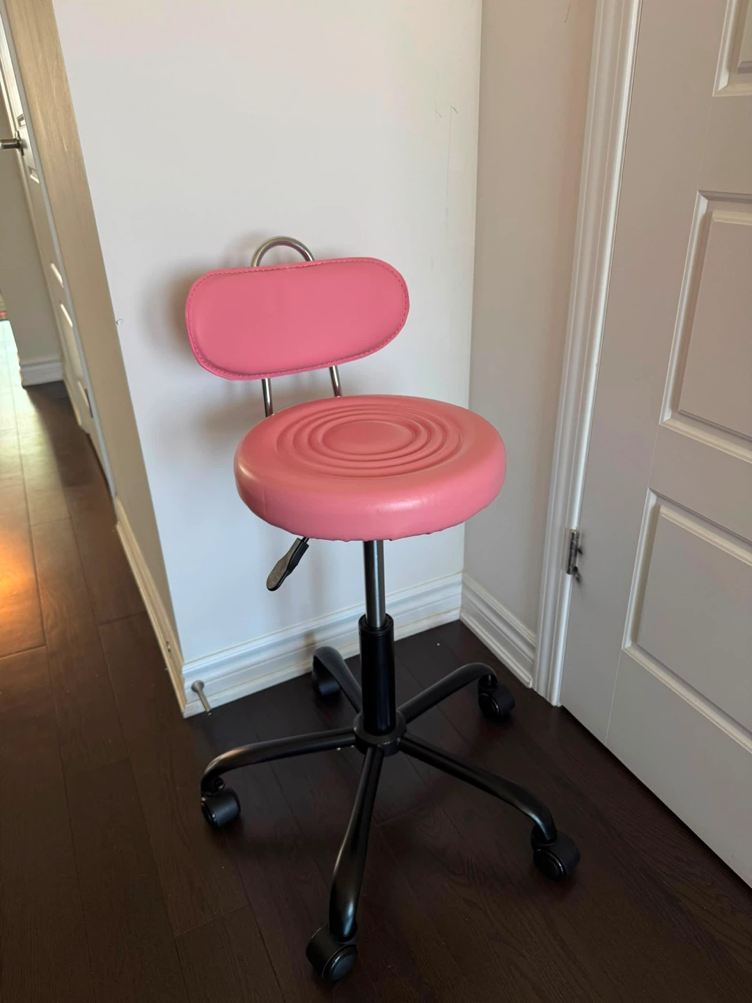 Pink rolling stool with back support