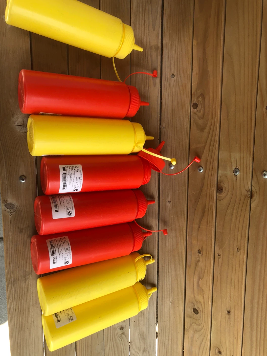 Set of Red and Yellow Squeeze Bottles
