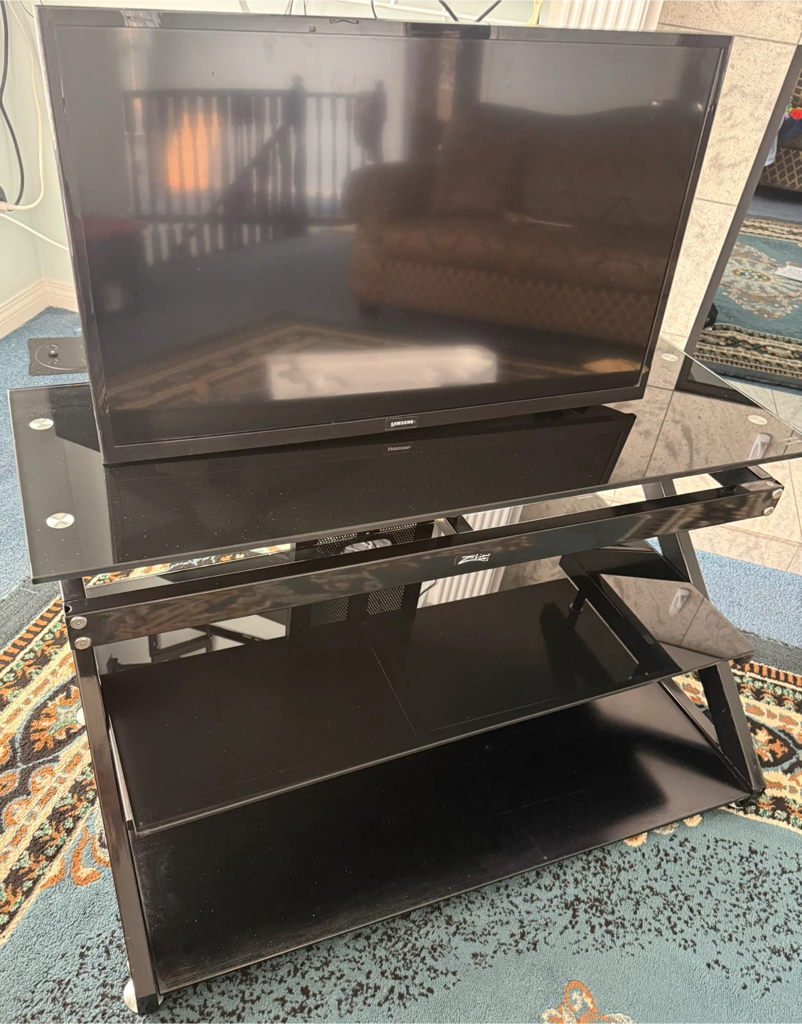 Insignia 32" LED TV with TV stand.