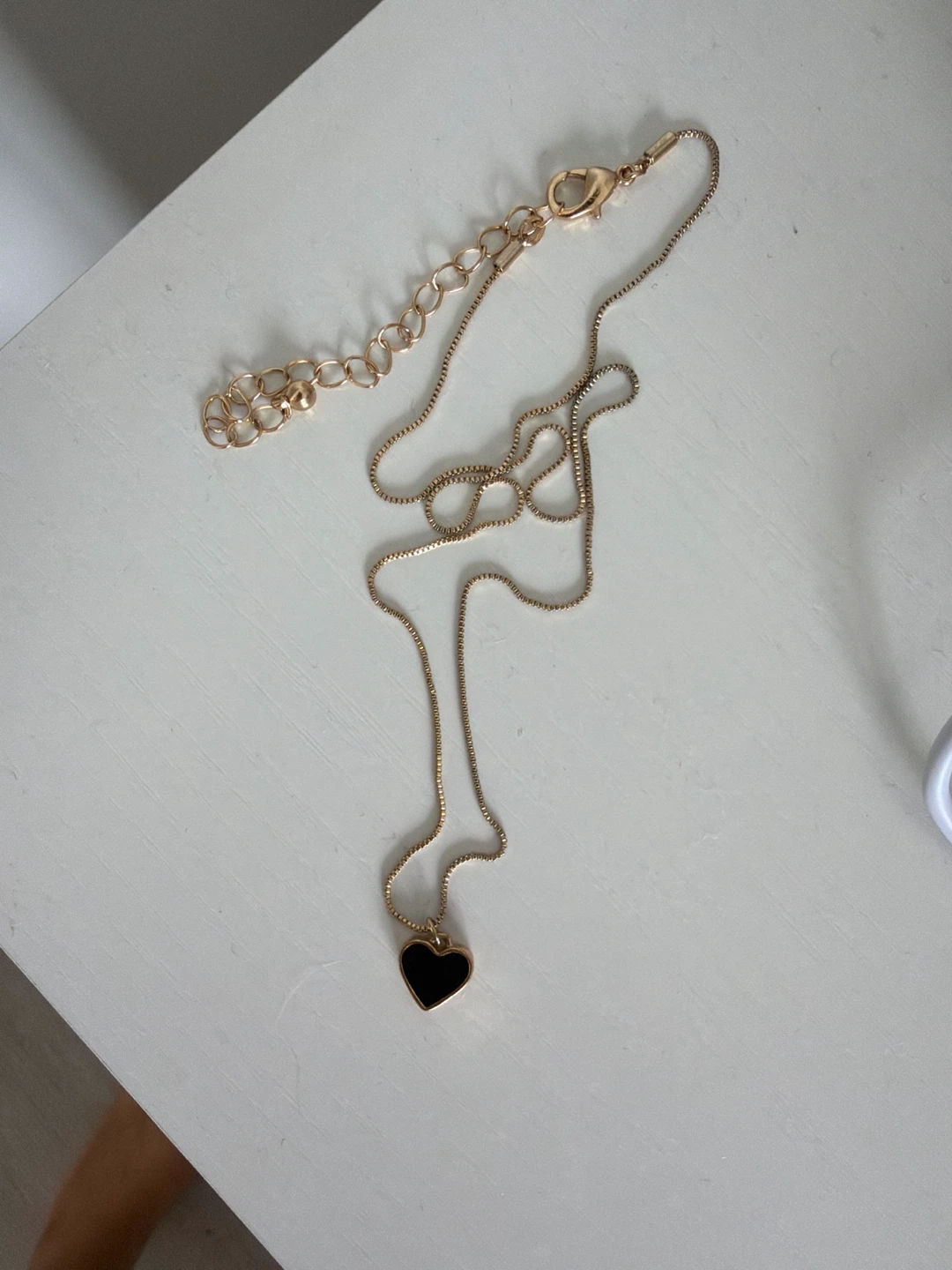 Gold Tone Necklace with Black Heart Pendant