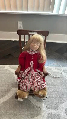 Vintage Porcelain Doll in Rocking Chair