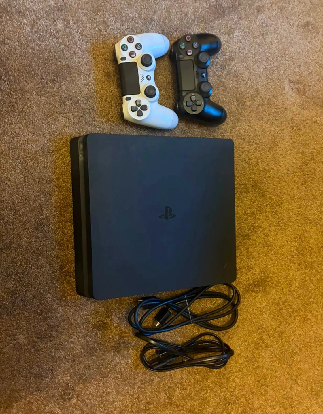 PlayStation 4 Slim Console with Two Controllers