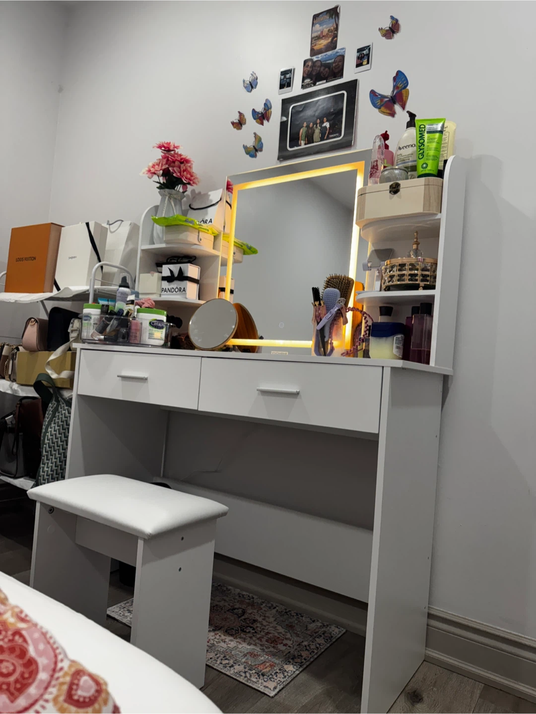 White vanity table with lighted mirror and stool