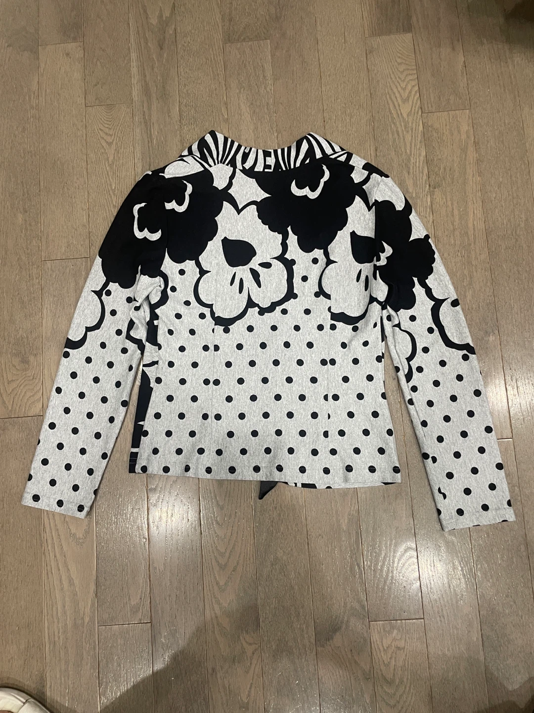 Rear view of a Women's Black and White Floral Print Cardigan