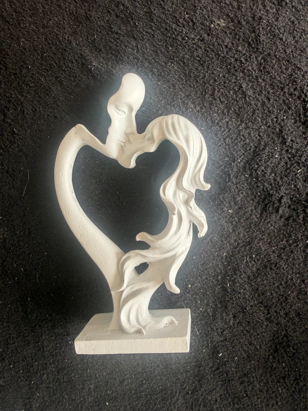 Sculpture of two embracing figures