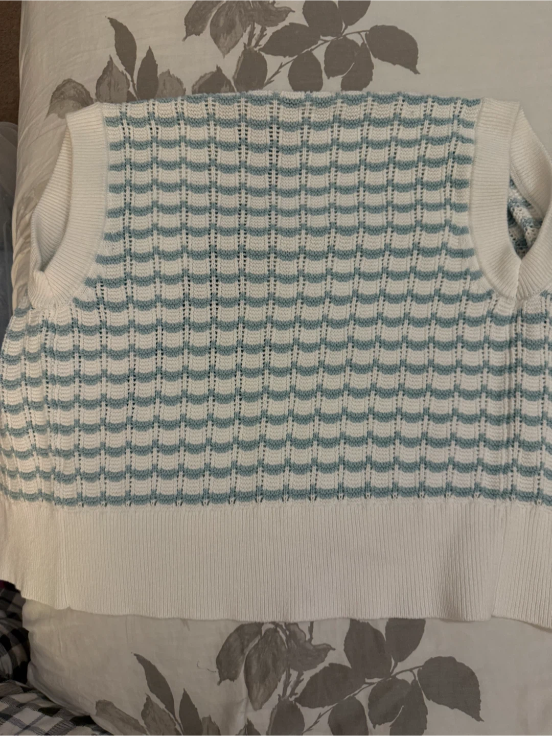 White and blue patterned knit vest