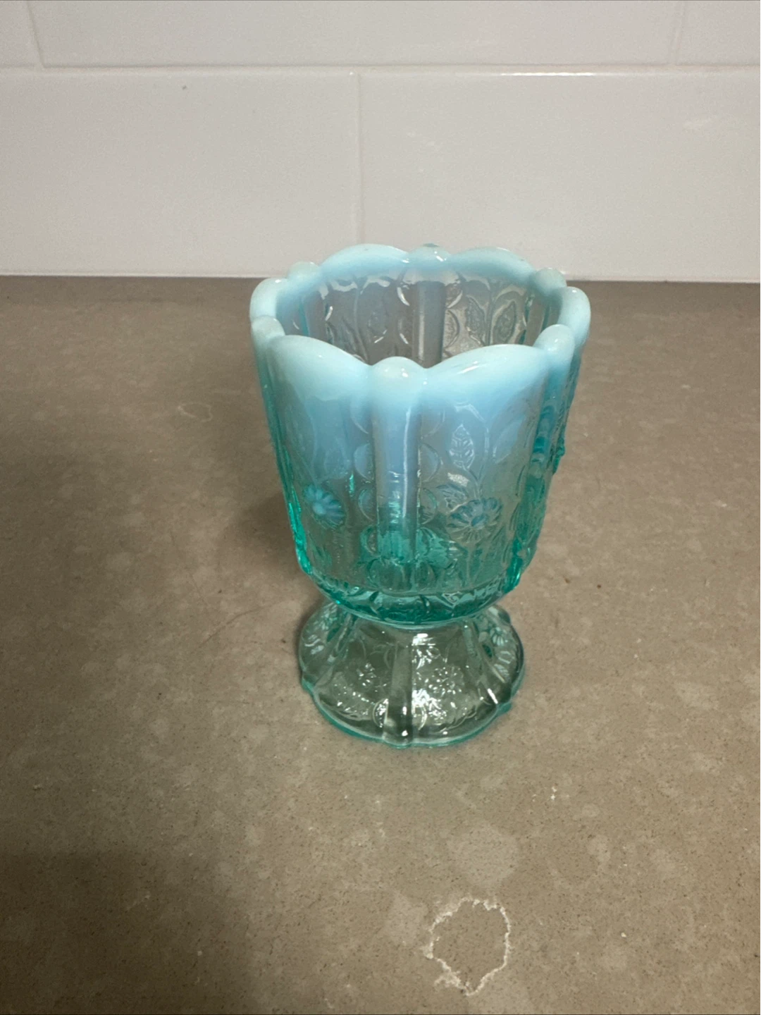 Small blue glass decorative vase
