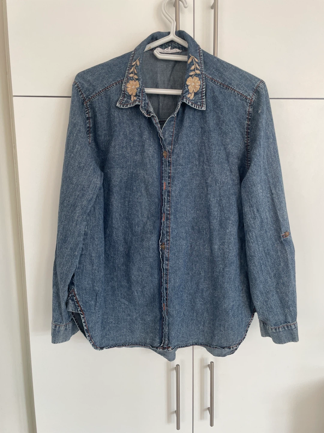 Denim Button-Up Shirt the collar has floral embroidery
