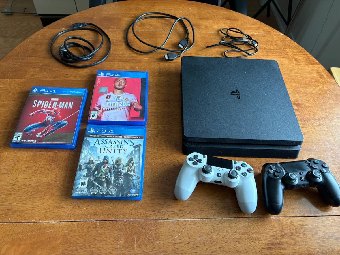 Sony PlayStation 4 (PS4) Slim Console with Games and Controllers