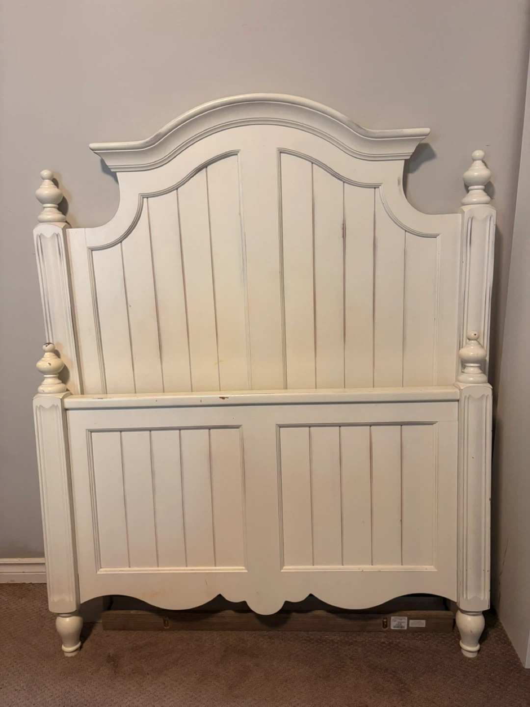 Twin bed (french/country) and nightstand.