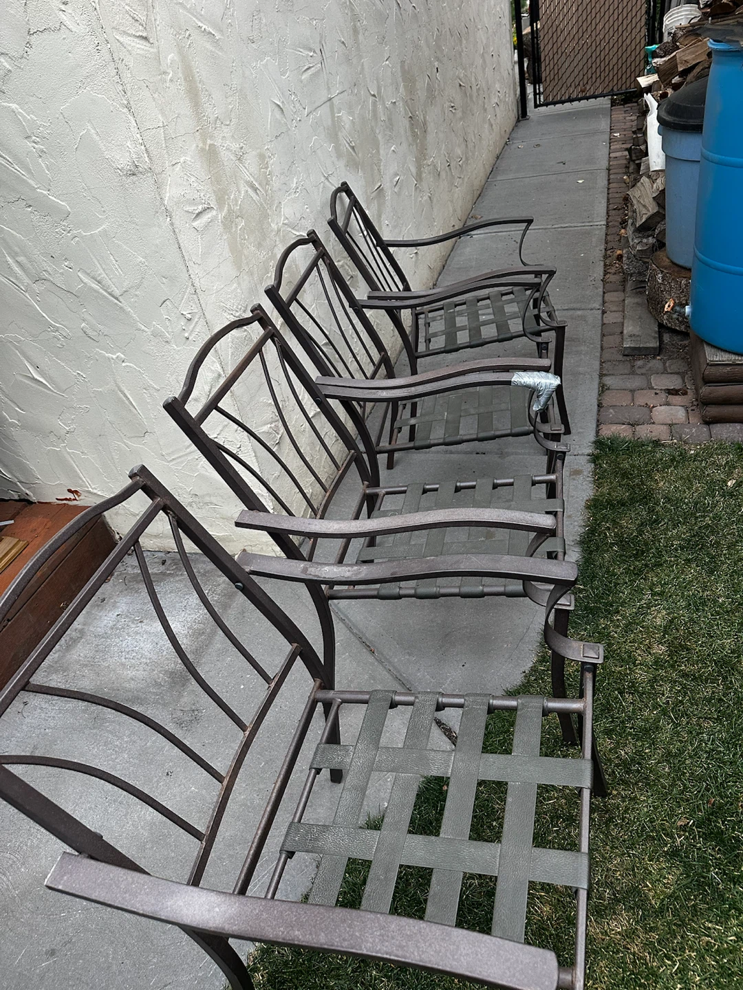Patio chairs with cushions and a table