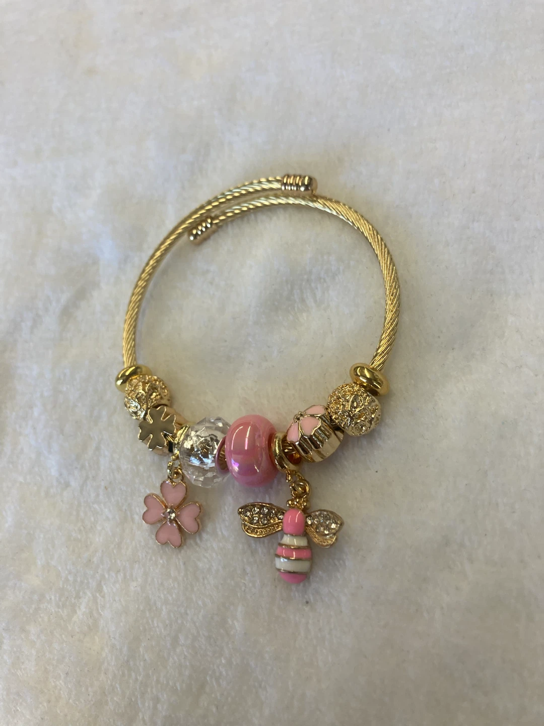 Gold Tone Charm Bracelet with Pink Accents