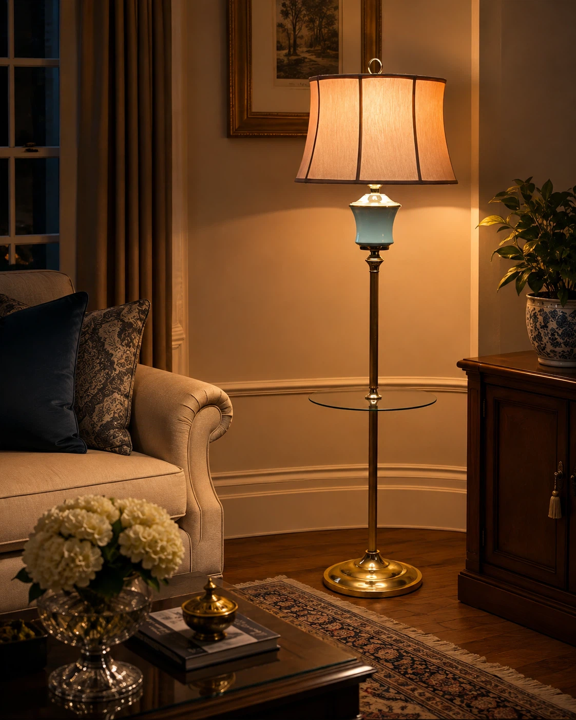 Brass floor lamp with glass shelf and beige shade