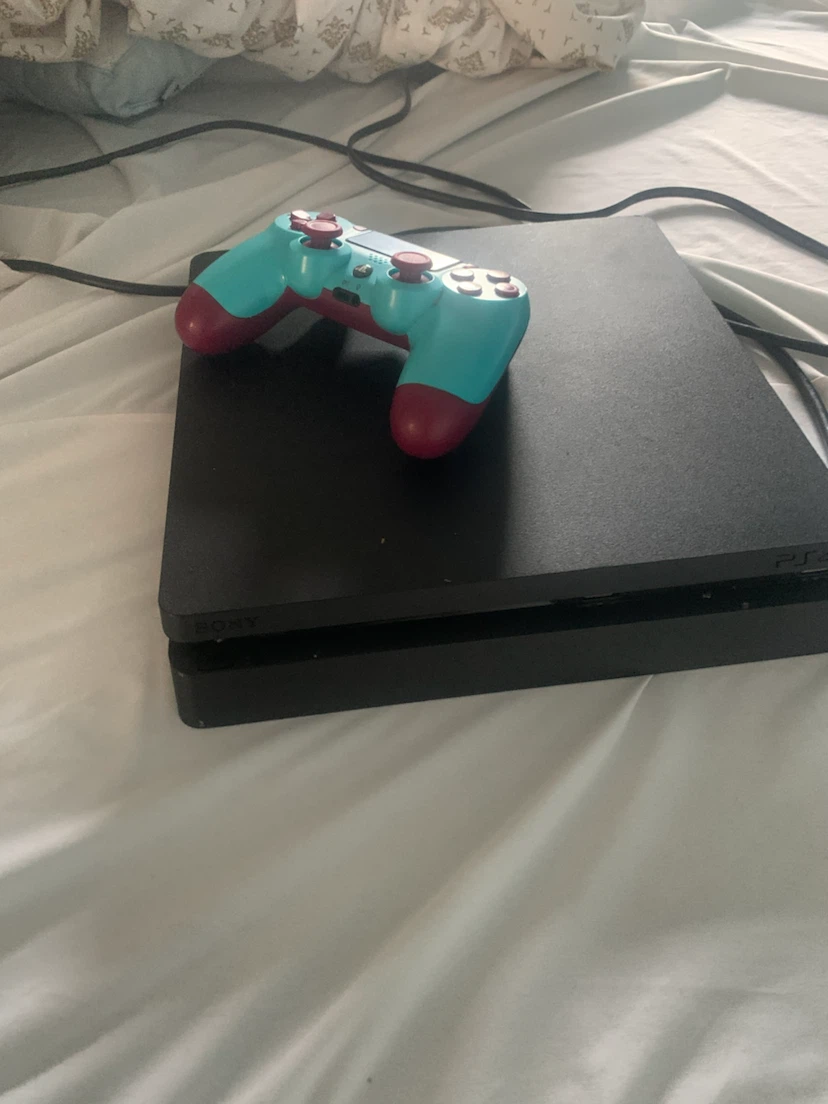 PlayStation 4 Slim Console with Teal and Pink Controller