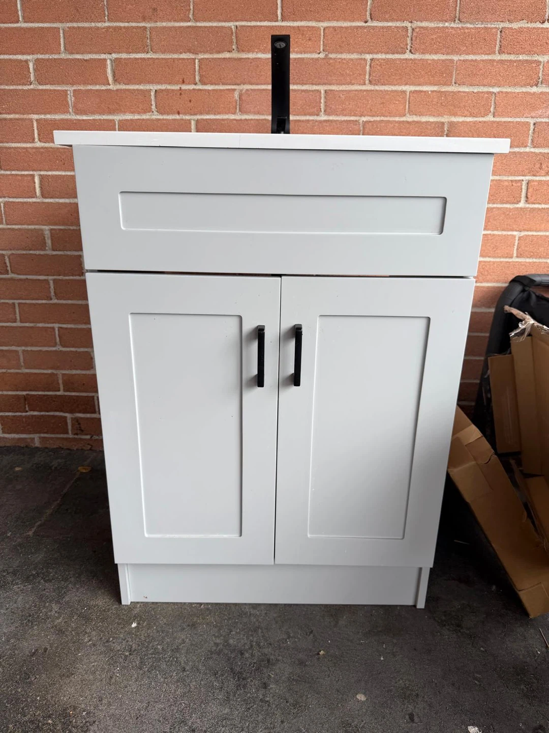 Light Grey Bathroom Vanity with Black Faucet