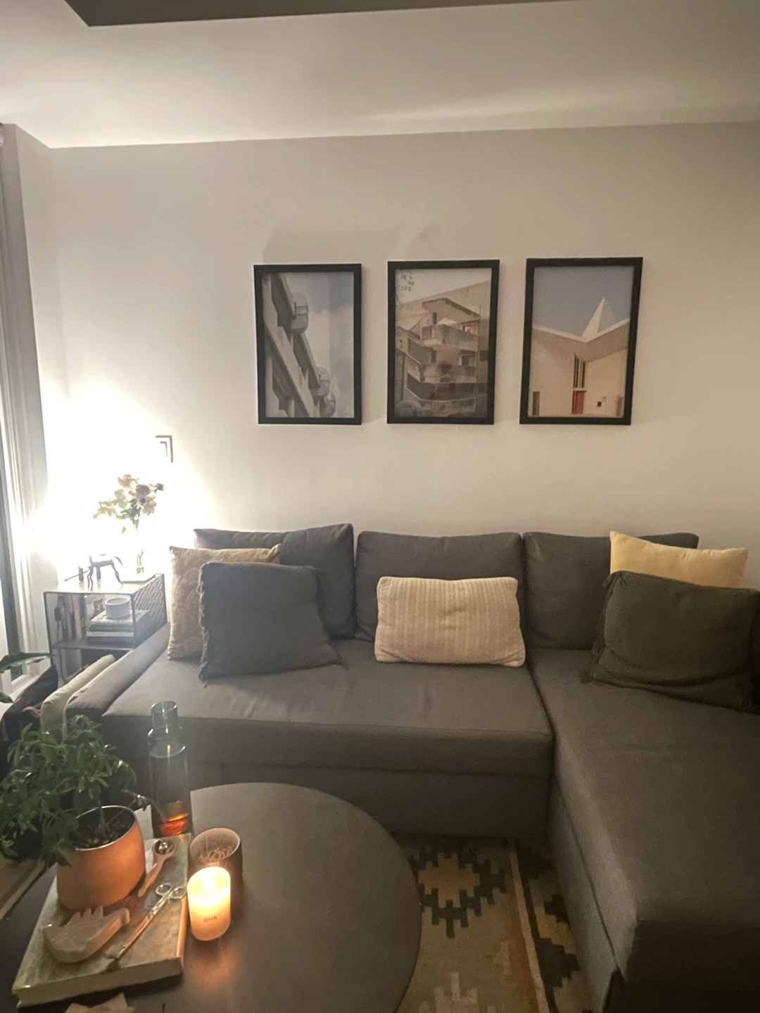 Grey L-shaped sofa with pullout bed & storage