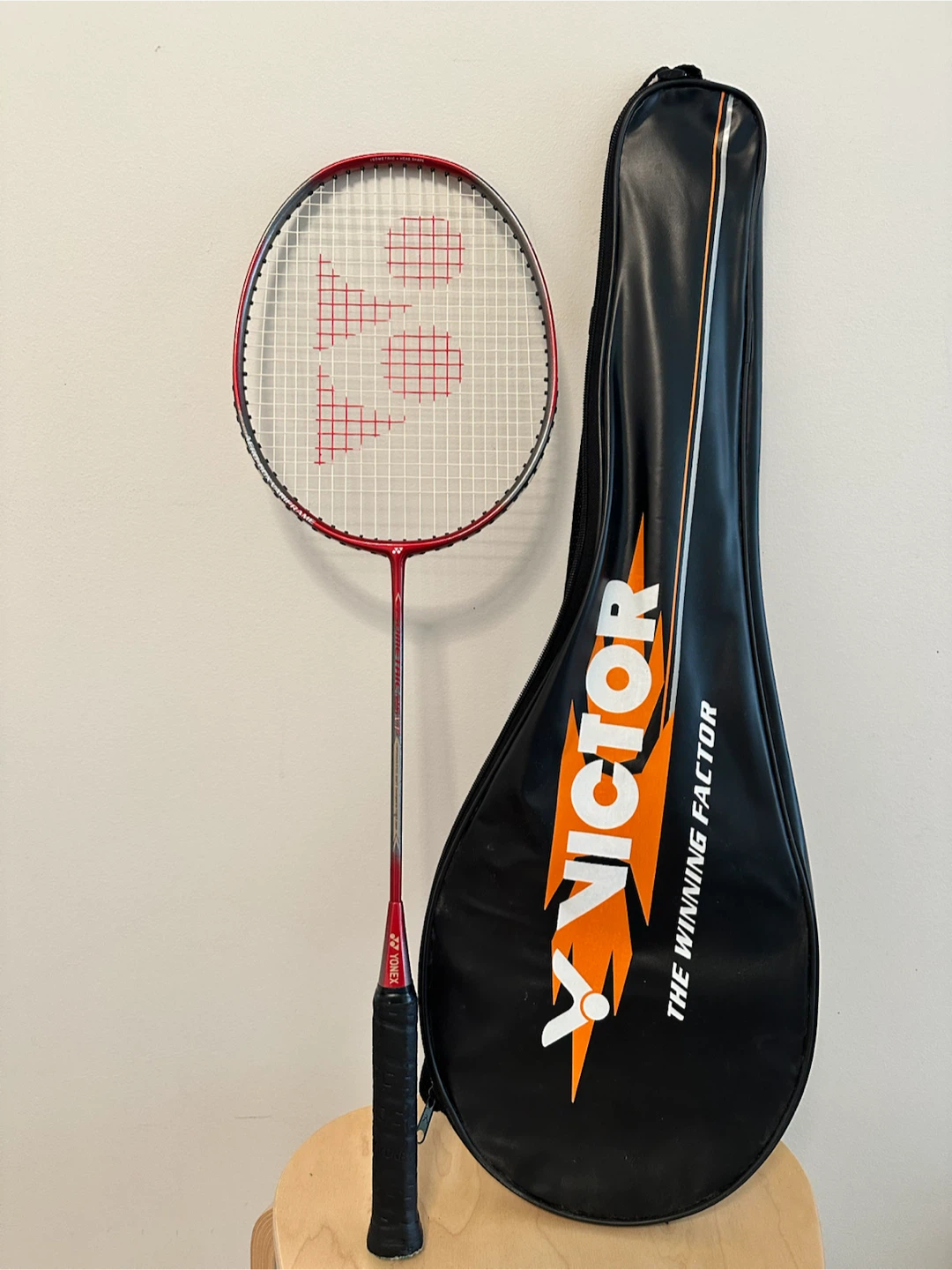 Red Yonex badminton racquet
